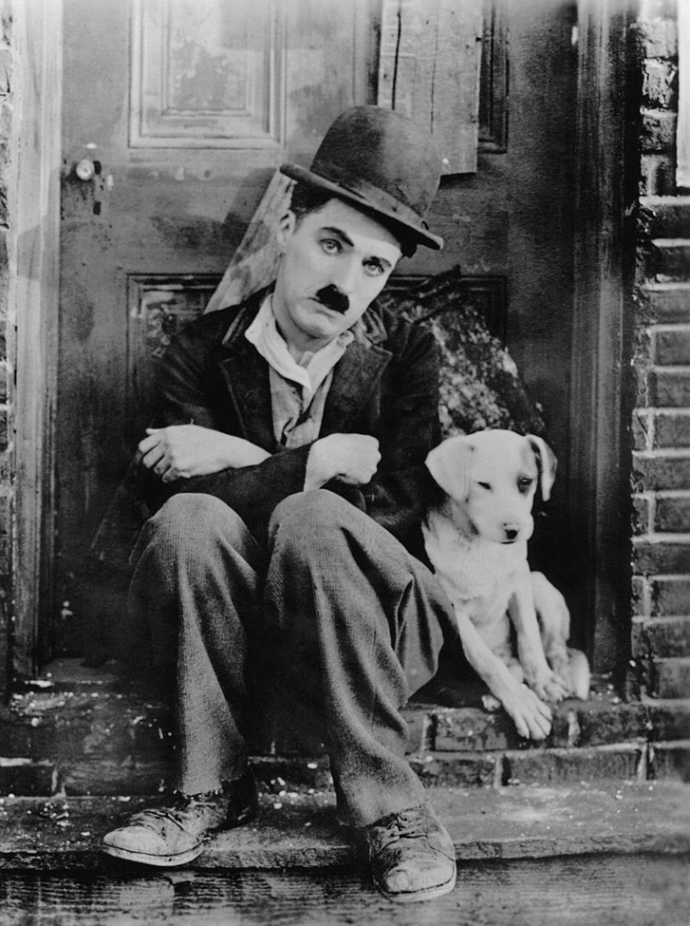 Charlie Chaplin as The Tramp and his dog in A Dog’s Life.